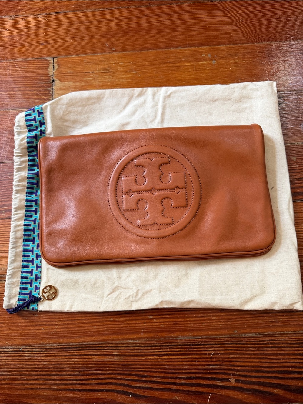Tory Burch Reva Bombe Leather Clutch with Strap + Embossed Logo